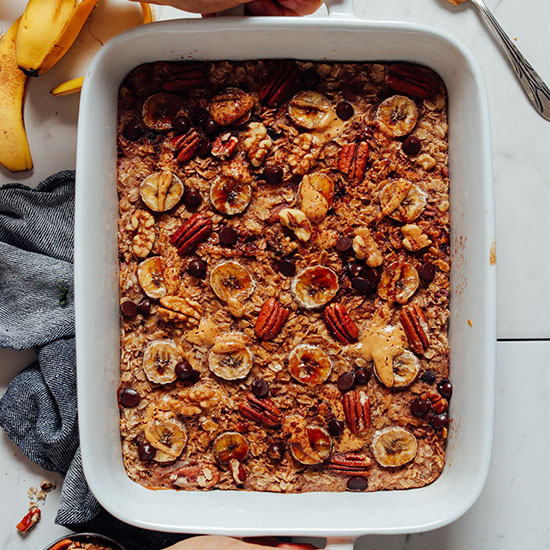 Baking dish of Chocolate Chip Banana Baked Oatmeal made with pecans