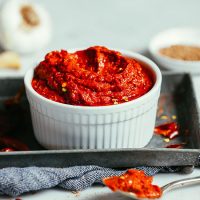 Tray with a bowl of Easy DIY Harissa Paste