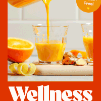 Pouring a lemon ginger turmeric wellness shot from a liquid measuring glass into a small drinking glass