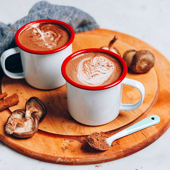 Cutting board with mugs of our homemade Mushroom Latte recipe