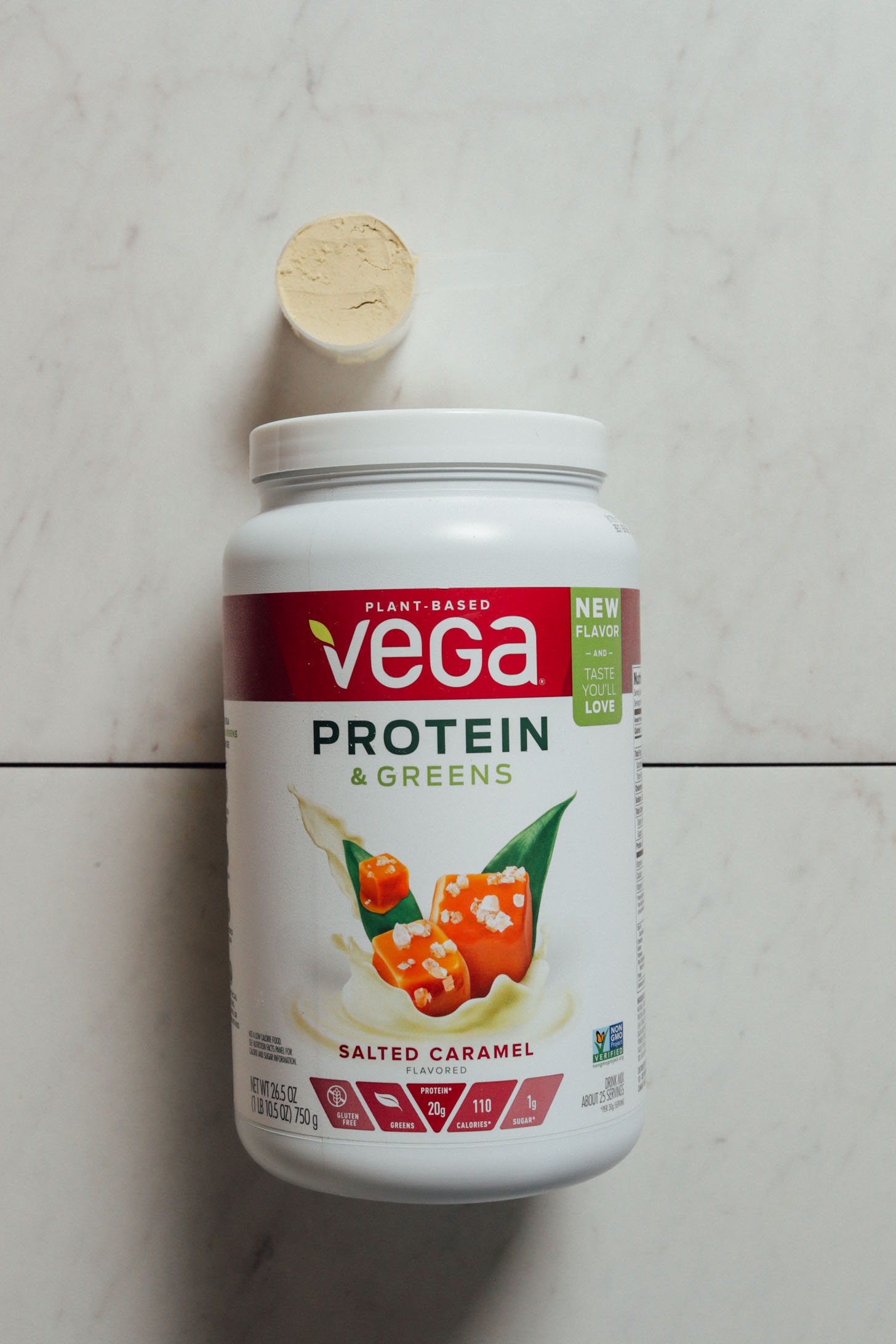 Tub and scoop of the delicious Vega Salted Caramel protein powder for our review
