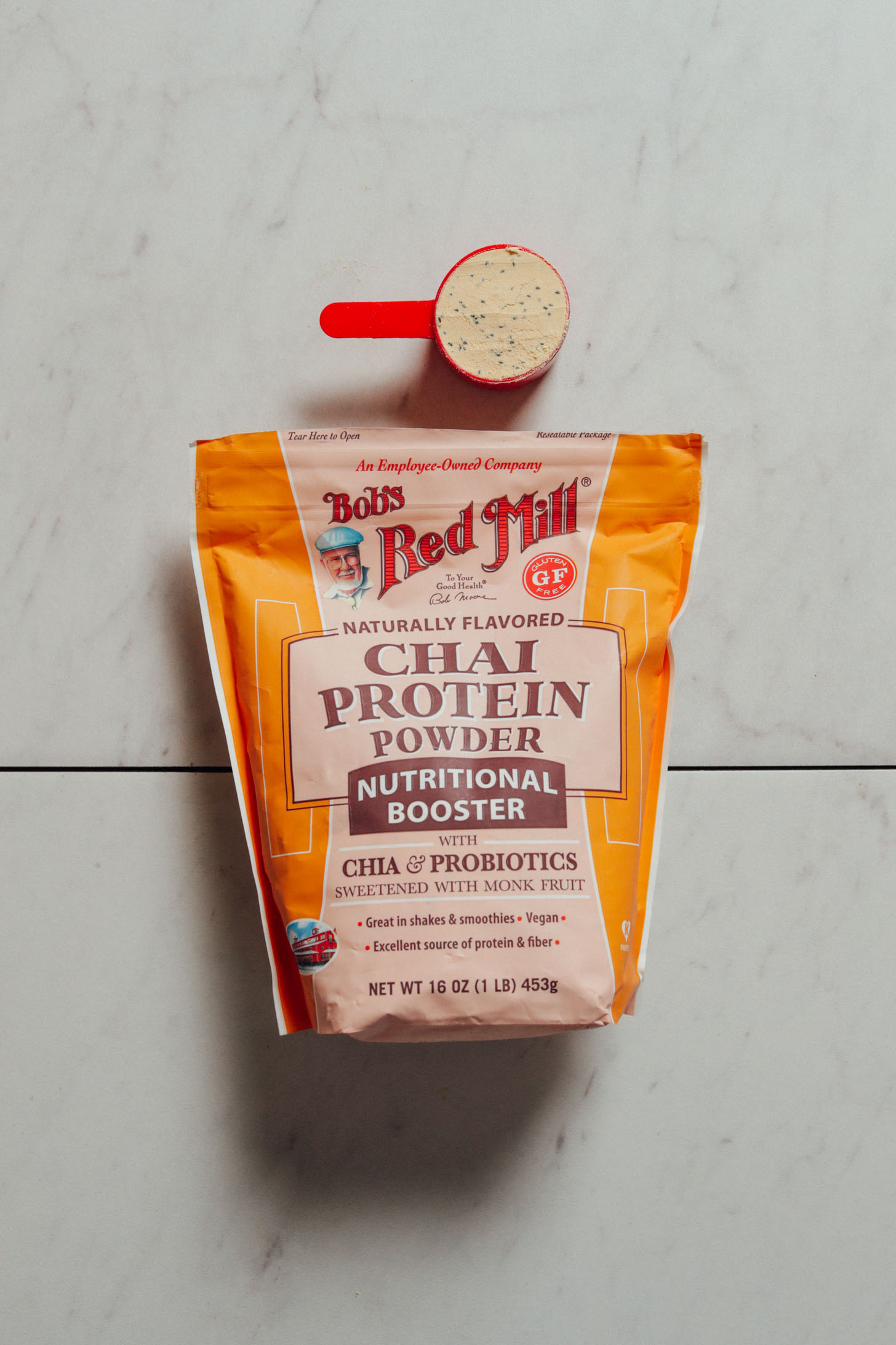 Scoop and pouch of Bob's Red Mill Chai Protein Powder for our review