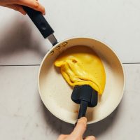 Cooking a Vegan Scrambled Egg in a cast-iron skillet