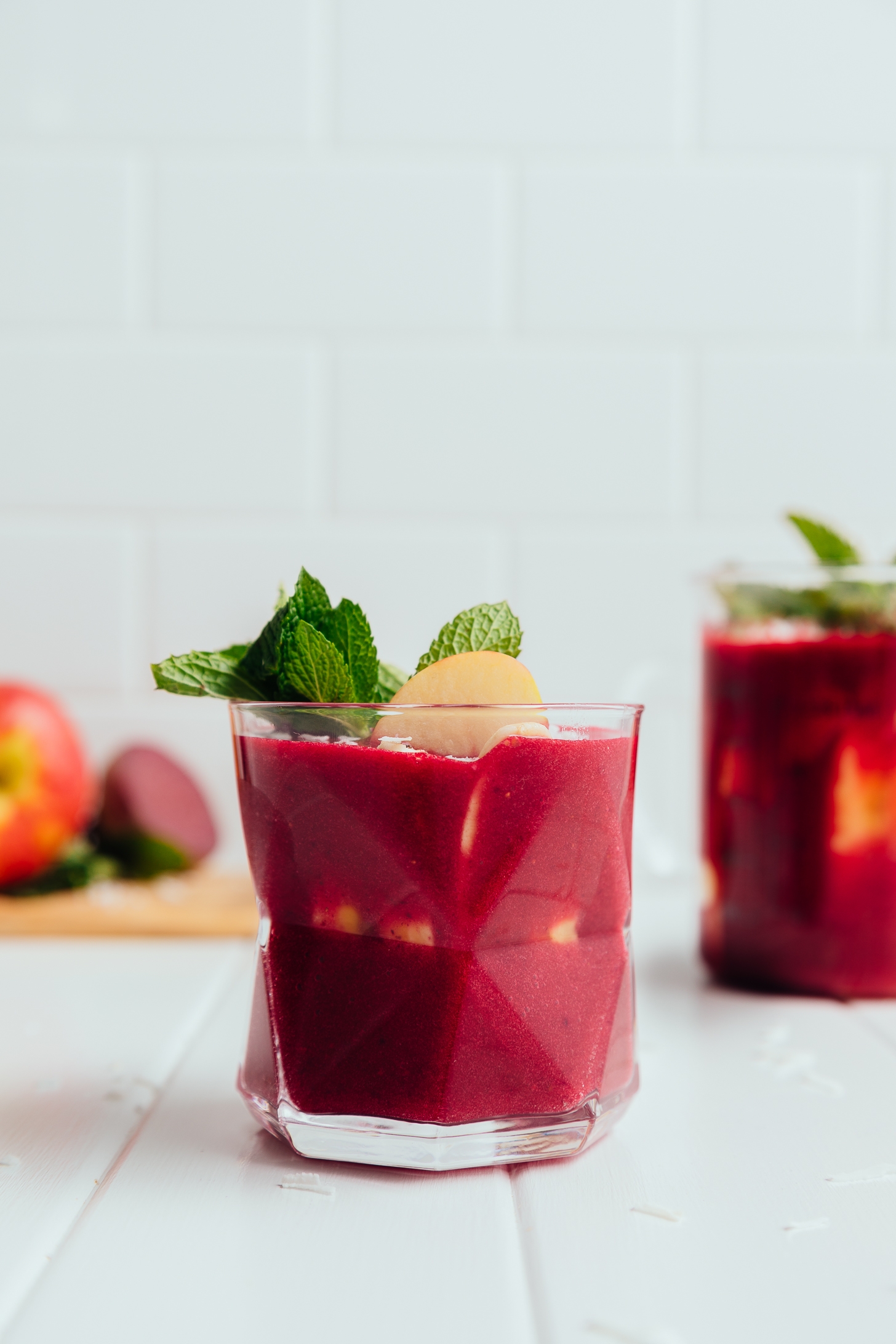 Geometric glass filled with our Beet and Berry Smoothie recipe for a delicious and detoxifying smoothie recipe