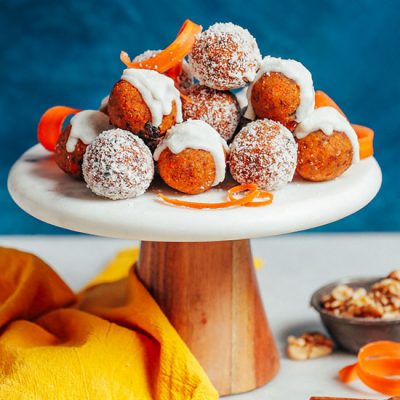 Raw Carrot Cake Bites resting on a cake platter