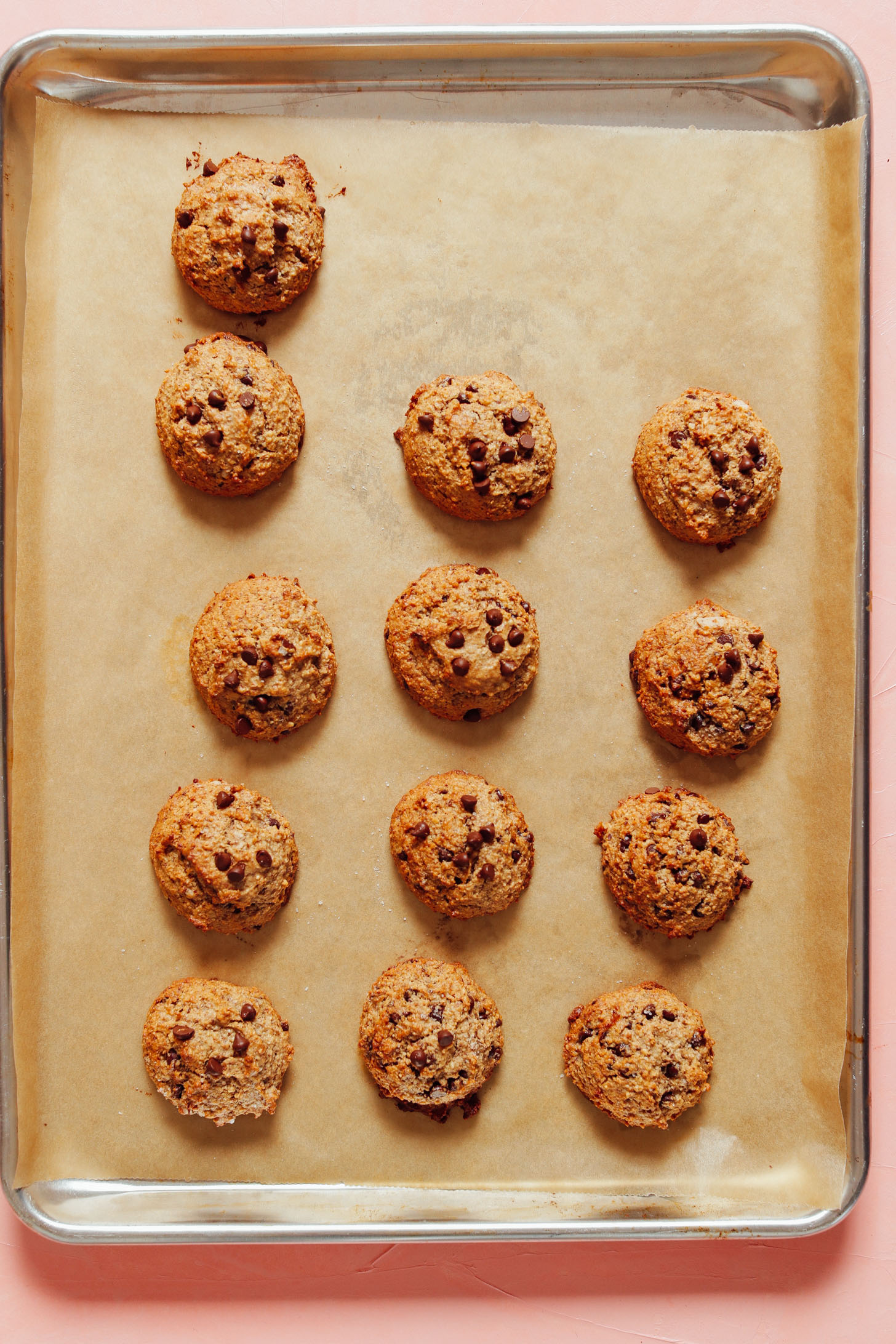 Parchment-lined baking sheet filled with freshly baked 1-Bowl Banana Chocolate Chip Cookies
