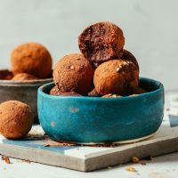 Bowl filled with a batch of our grain-free Brownie Bliss Balls recipe