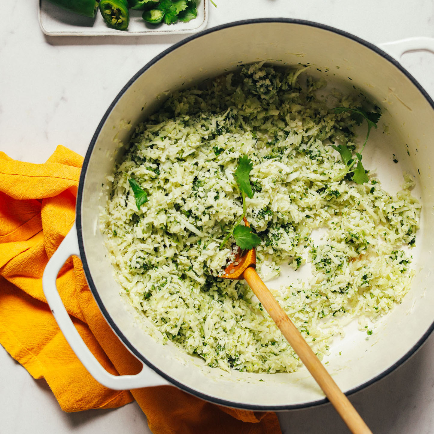 Cooking Mexican-inspired Easy Green Cauliflower Rice in a dutch oven