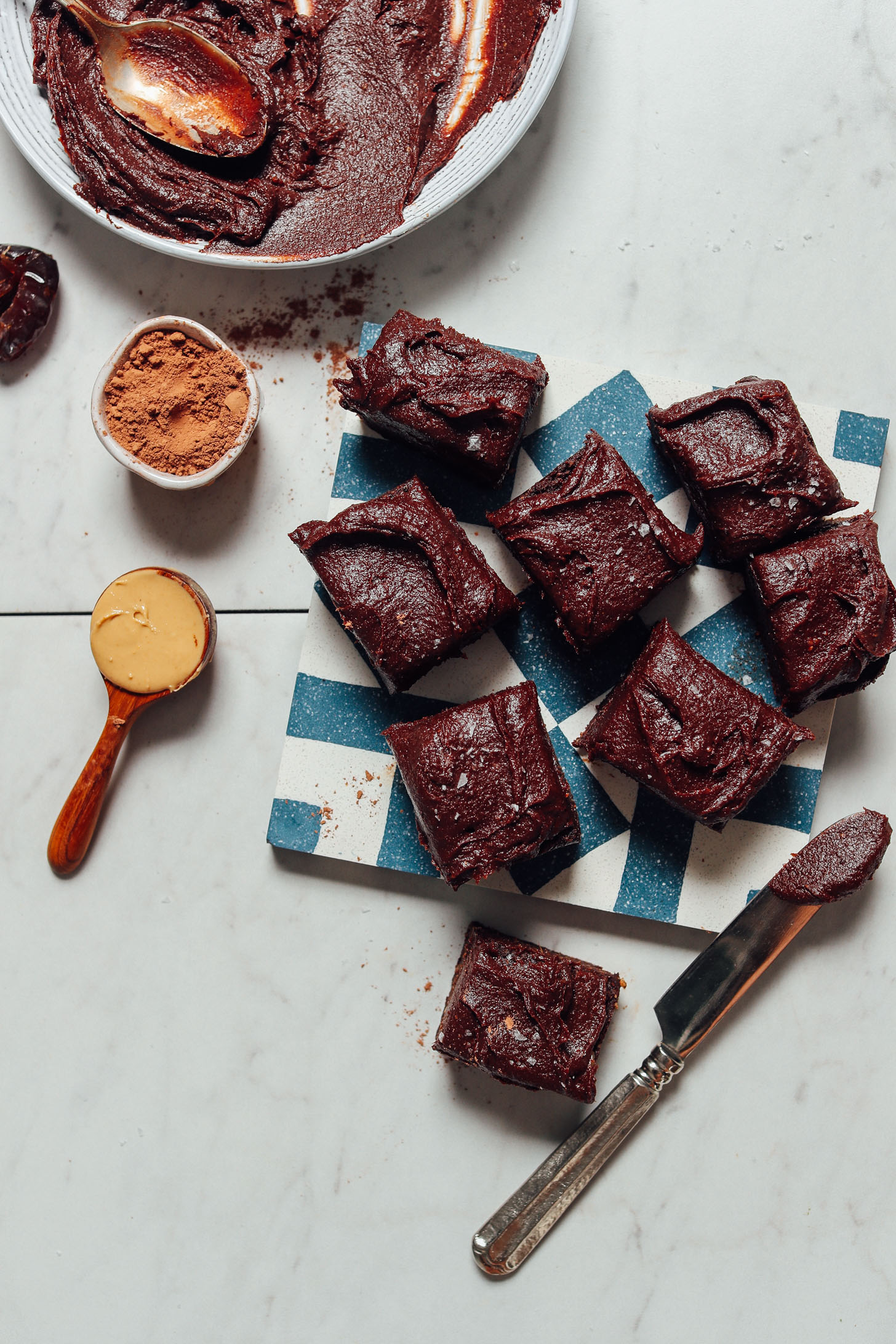 Overhead image of brownies with date chocolate frosting