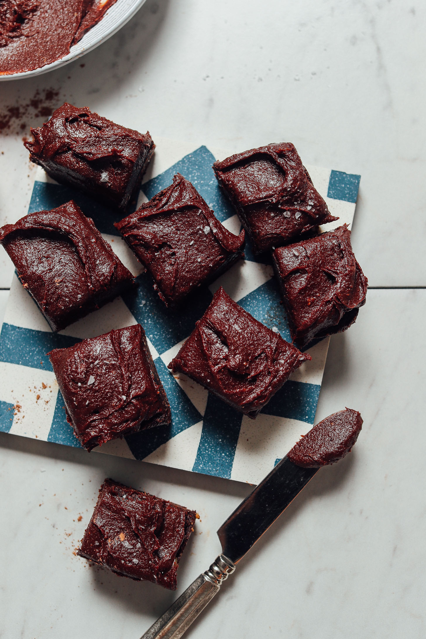 Date-sweetened Vegan Chocolate Frosting spread onto brownie squares