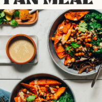 Two bowls of our easy vegan sheet pan meal with curried sweet potatoes and chickpeas