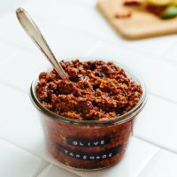 Jar of Sun-Dried Tomato and Basil Olive Tapenade for spreading on crackers or vegetables