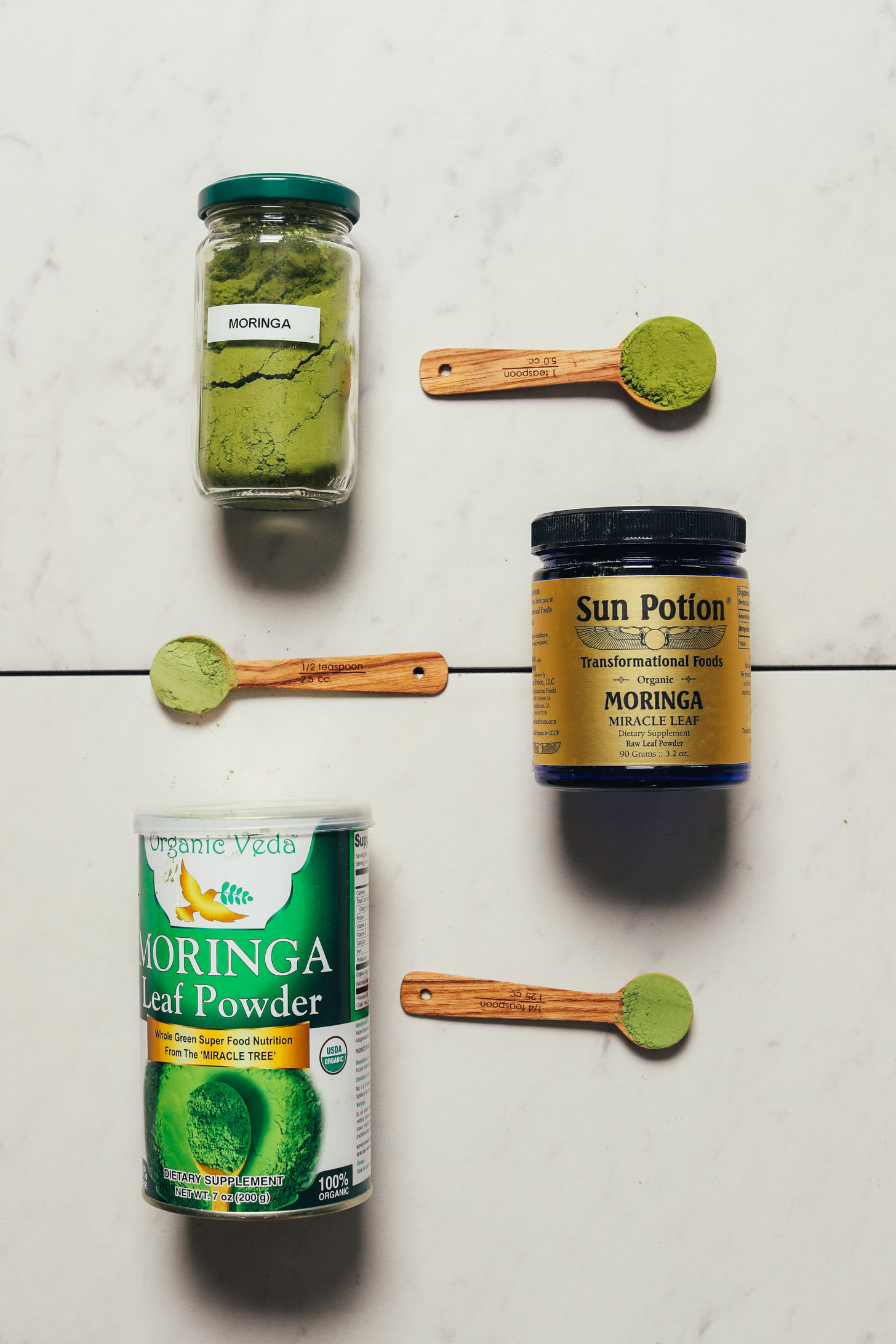 Three jars of moringa for our review of the best brands of moringa powder