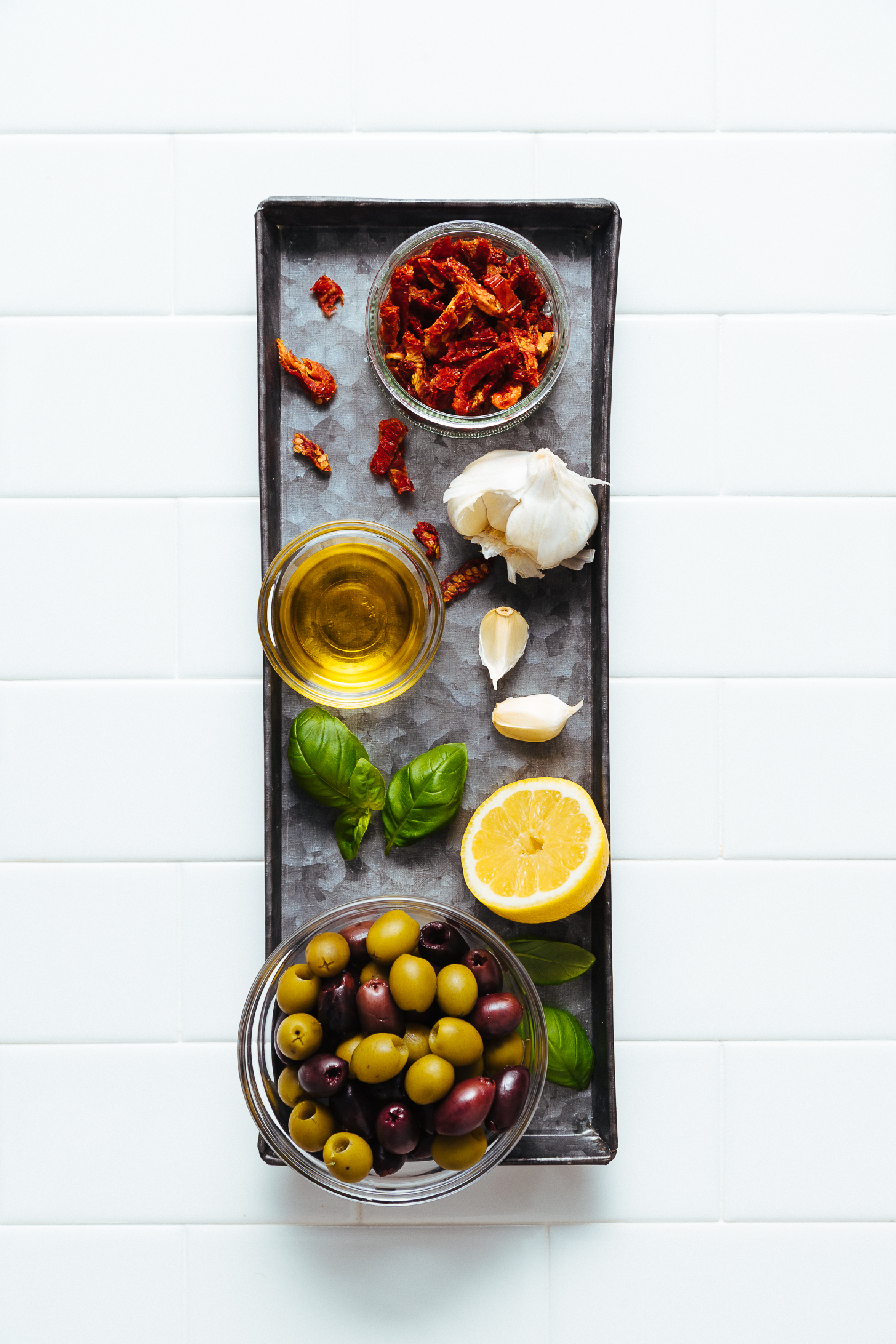 Tray of ingredients for making our Sun-Dried Tomato and Basil Olive Tapenade recipe