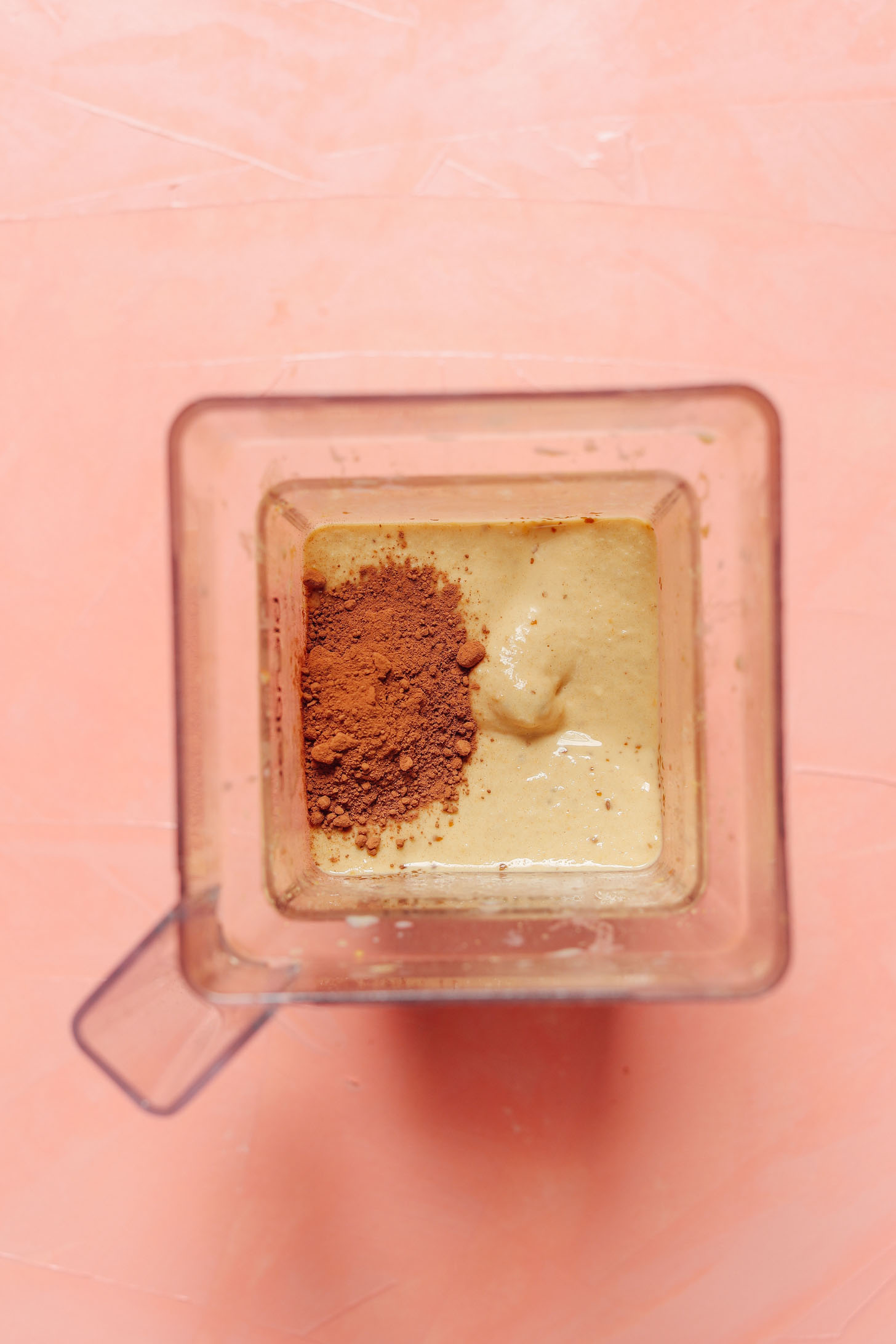 Cocoa powder in a blender for our Creamy Chocolate Chickpea Shake recipe