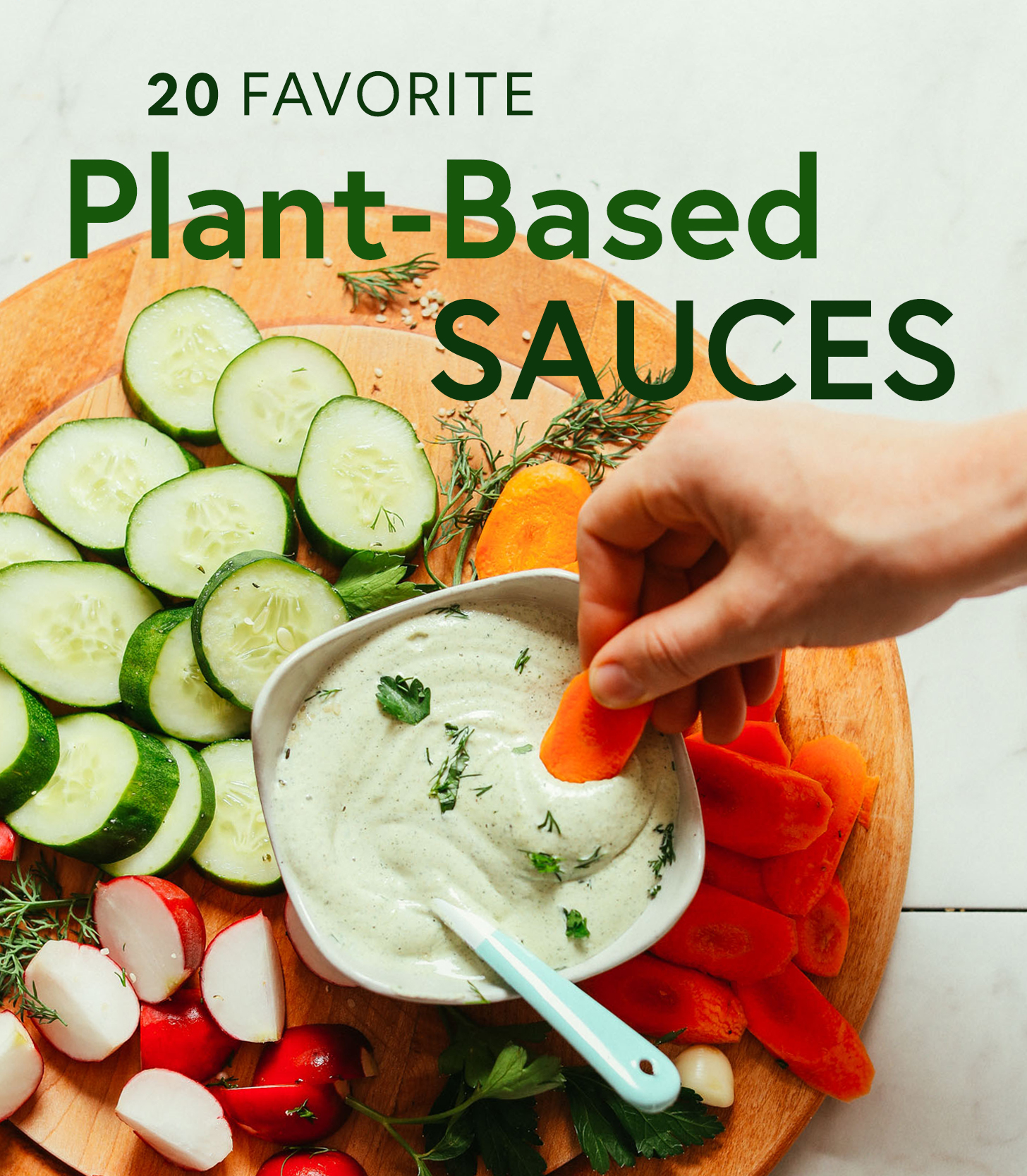 Dipping a carrot slice into a bowl of vegan ranch for our Plant-Based Sauces Roundup