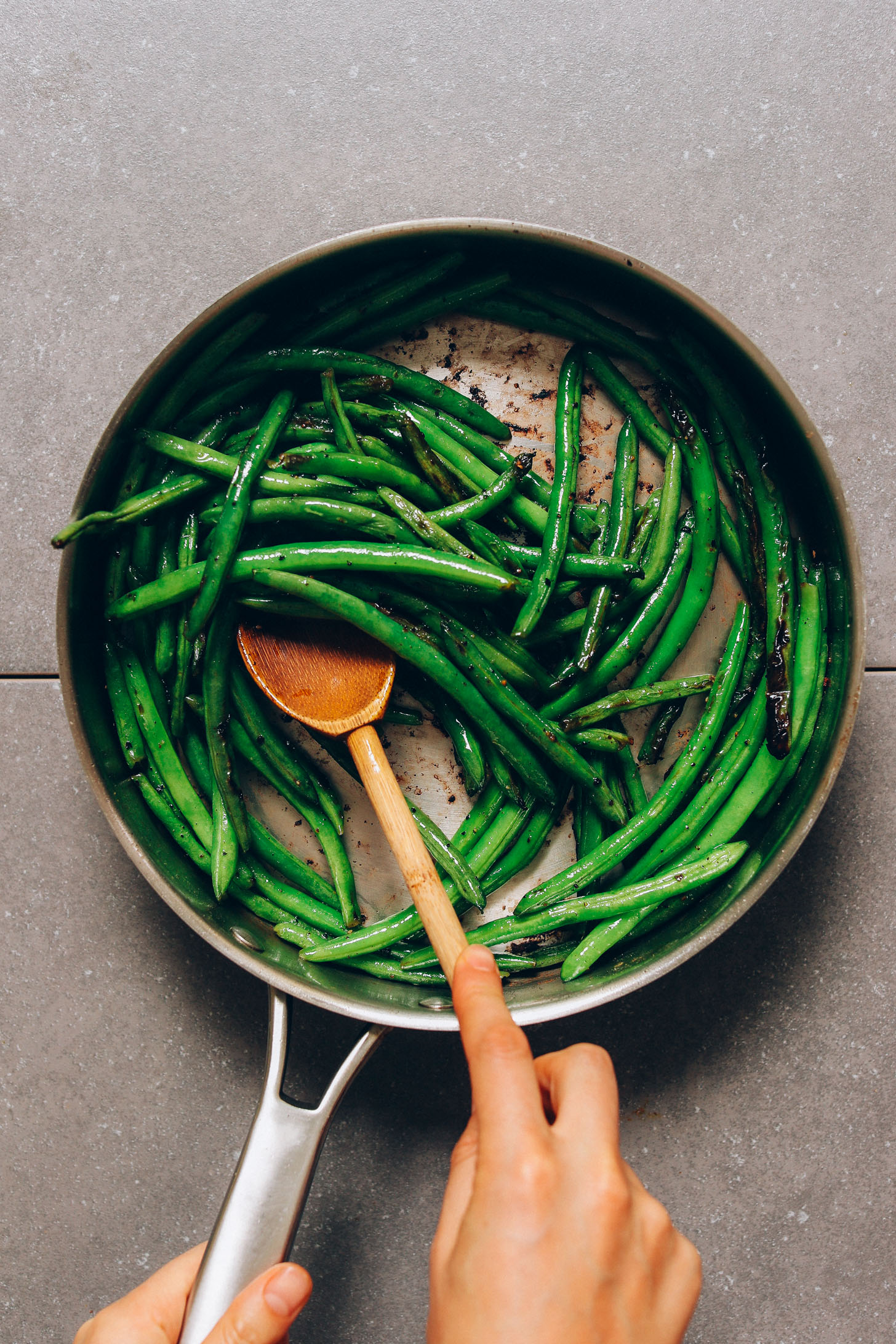 Showing How to Cook Green Beans in a pan
