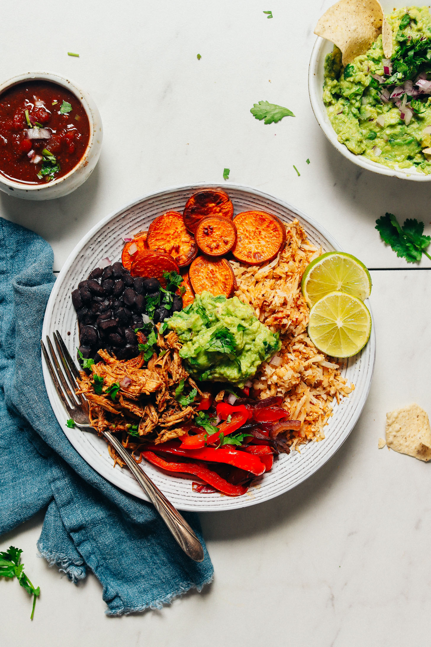 Grain-Free Burrito Bowl made with cauliflower rice, peppers, black beans, and sweet potatoes