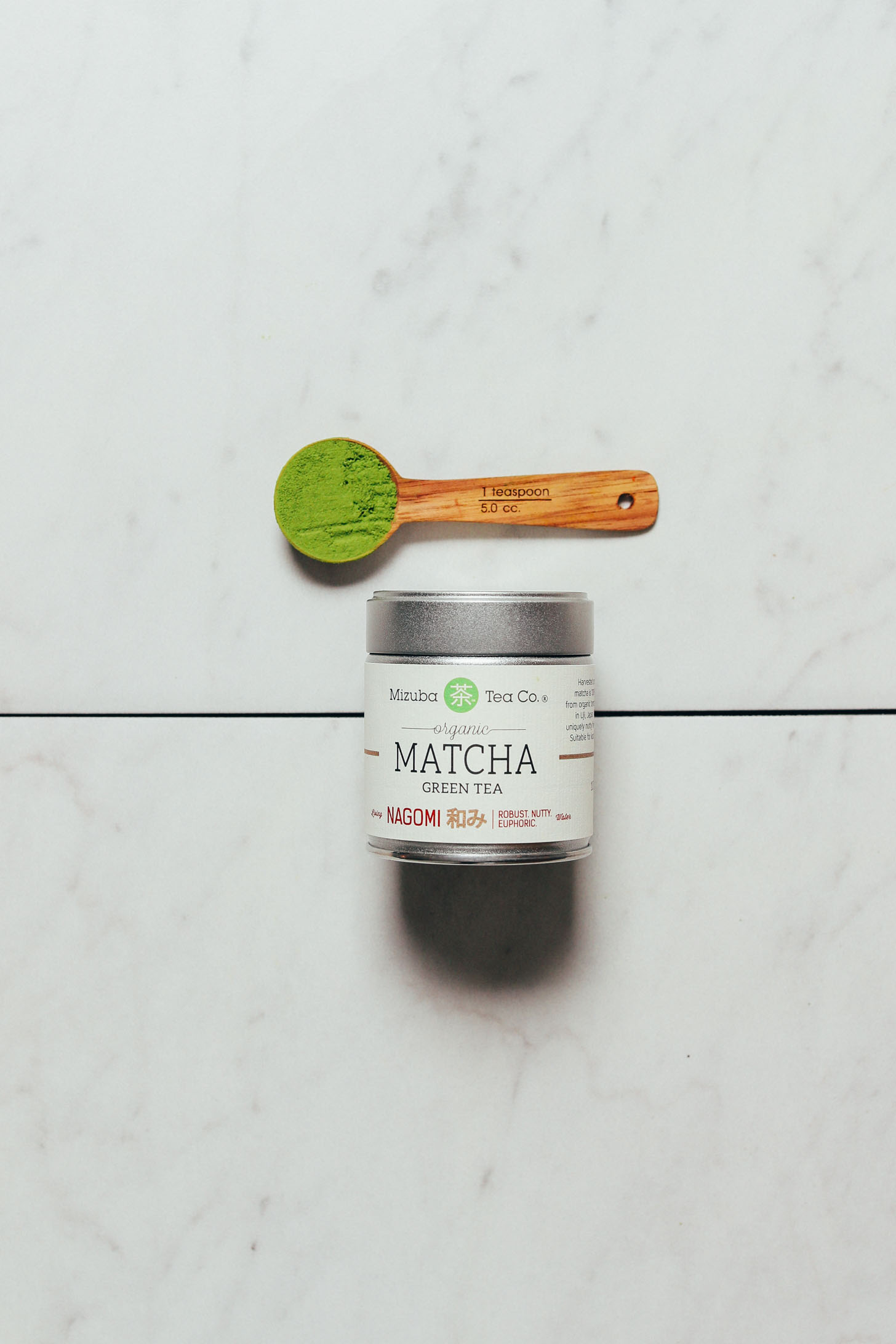 Spoonful and jar of Mizuba Ceremonial Matcha for our review of the best brands of matcha