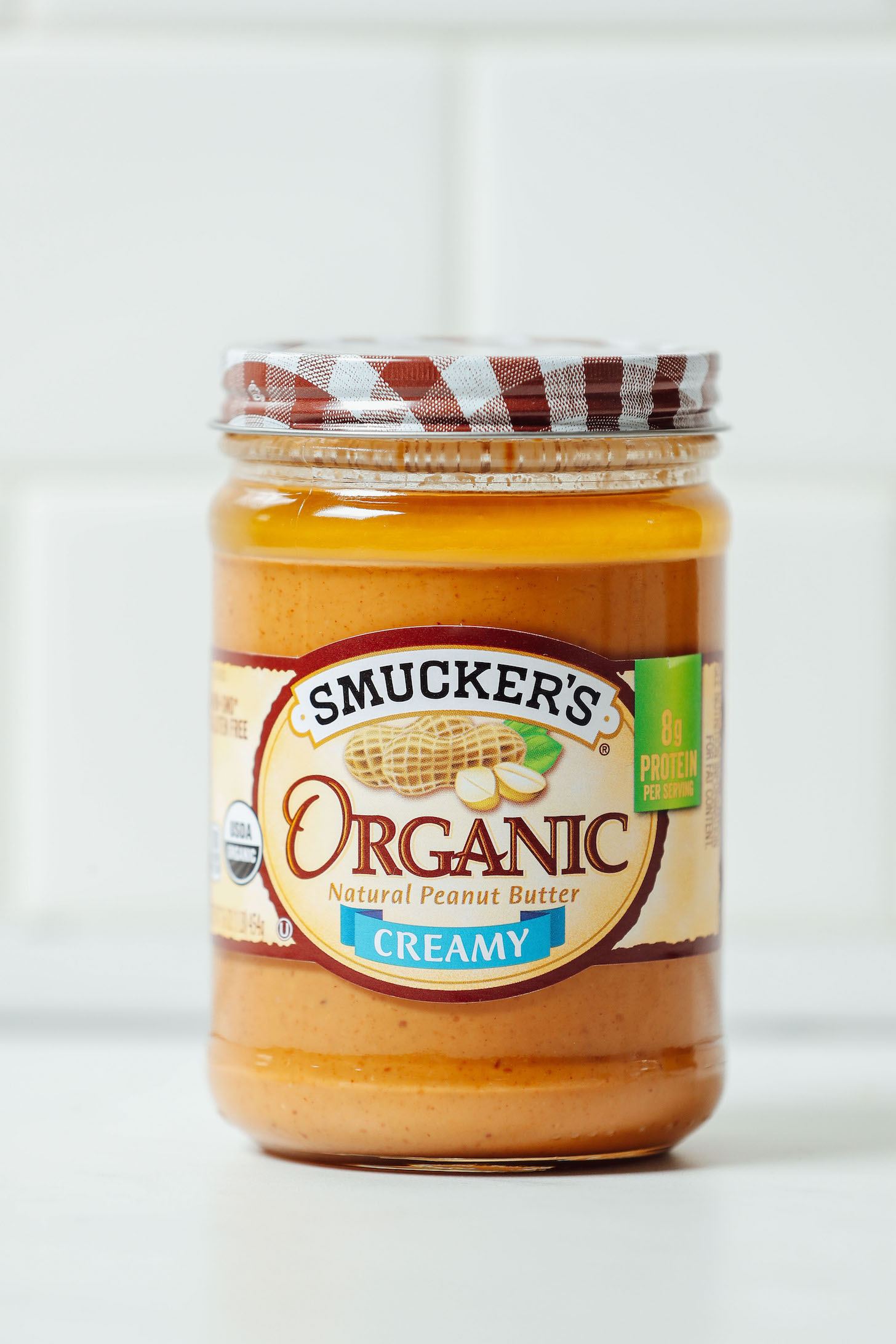 Jar of Smucker's Organic Peanut Butter for our review of the best brands of natural peanut butter