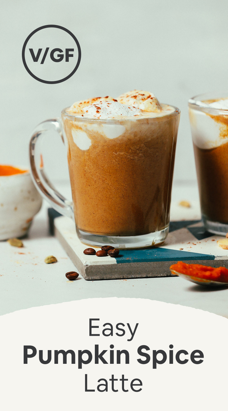 Mugs of our Easy Pumpkin Spice Latte recipe topped with coconut whipped cream and pumpkin pie spice