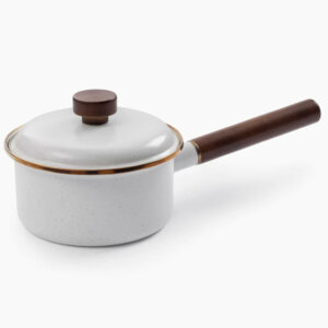 A small speckled white saucepan with a brown handle