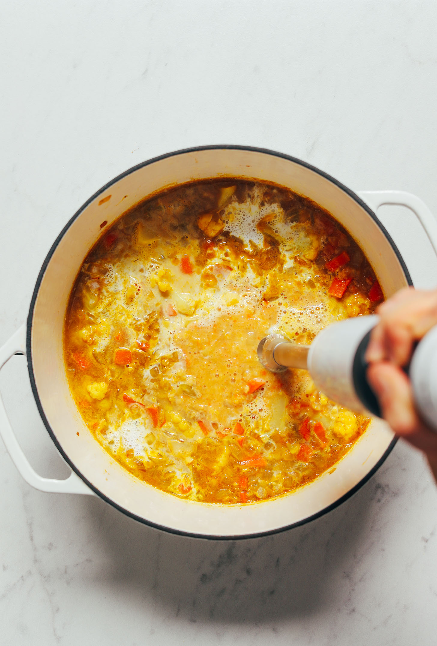 Using an immersion blender to make Creamy Curried Cauliflower Soup