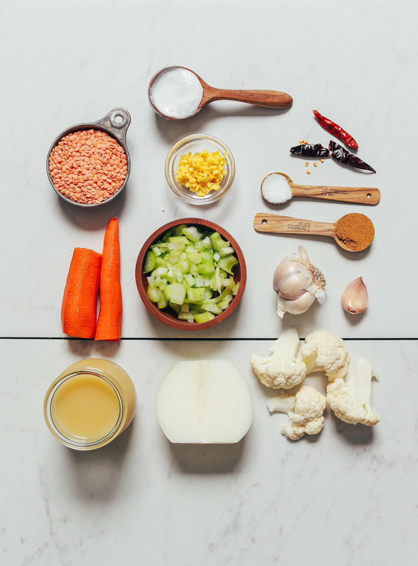 Carrots, celery, cauliflower, garlic, and other ingredients for making our Curried Cauliflower Lentil Soup recipe