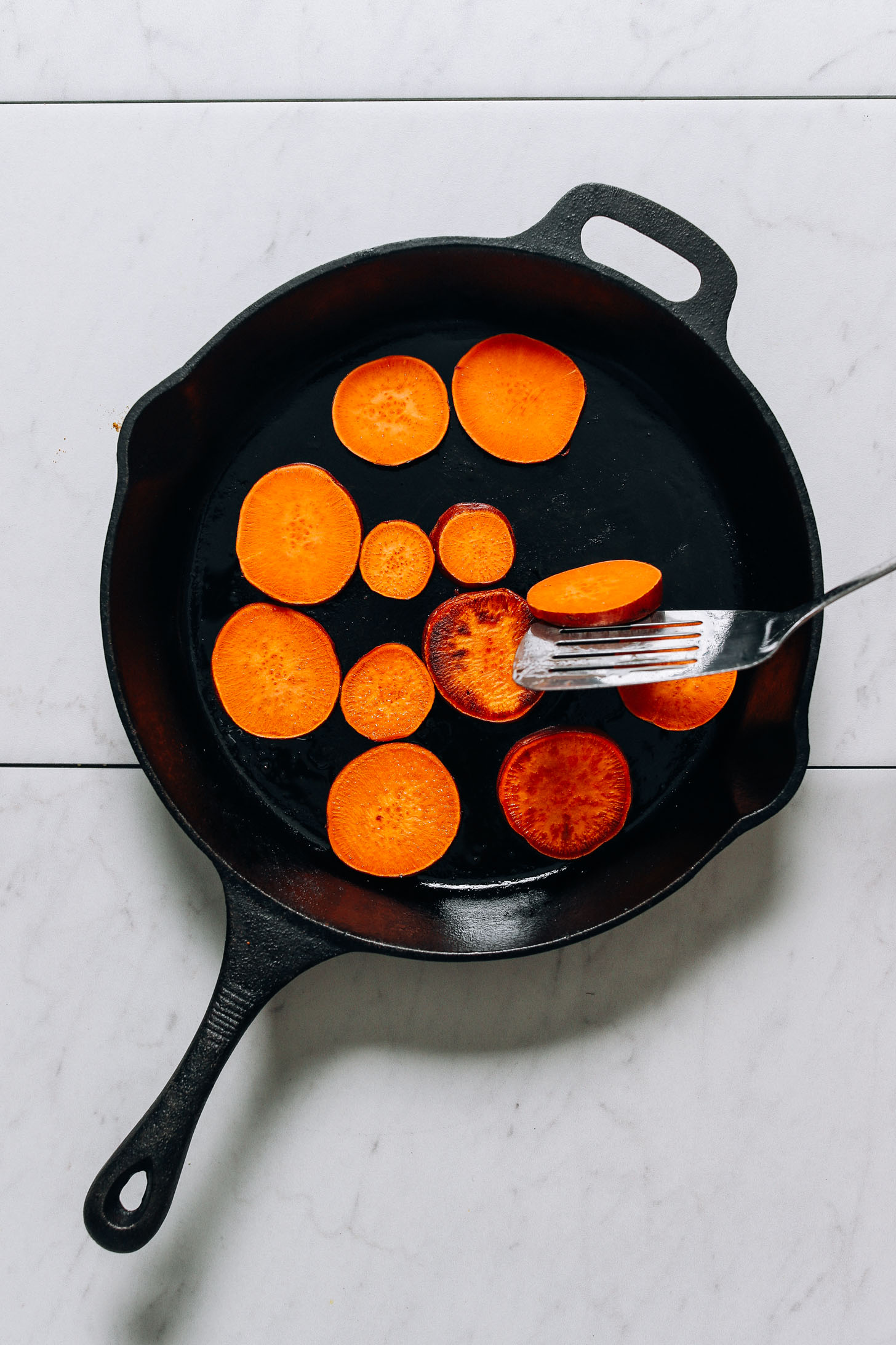 Cooking sweet potatoes in a cast iron skillet