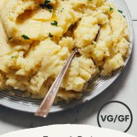 Bowl of easy vegan Mashed Potatoes topped with fresh parsley