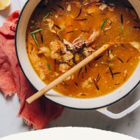 Wooden spoon in a pot of Chicken Bone Broth