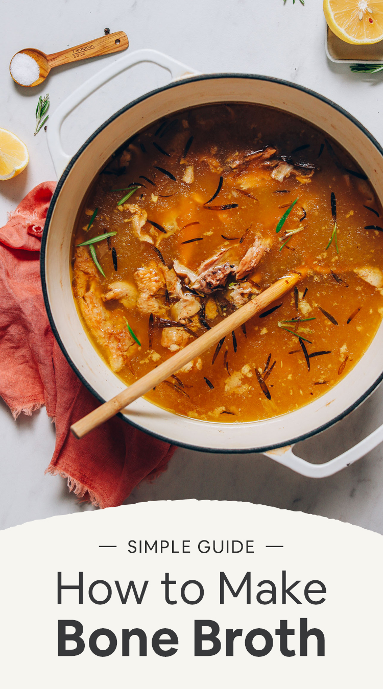 Wooden spoon in a pot of Chicken Bone Broth