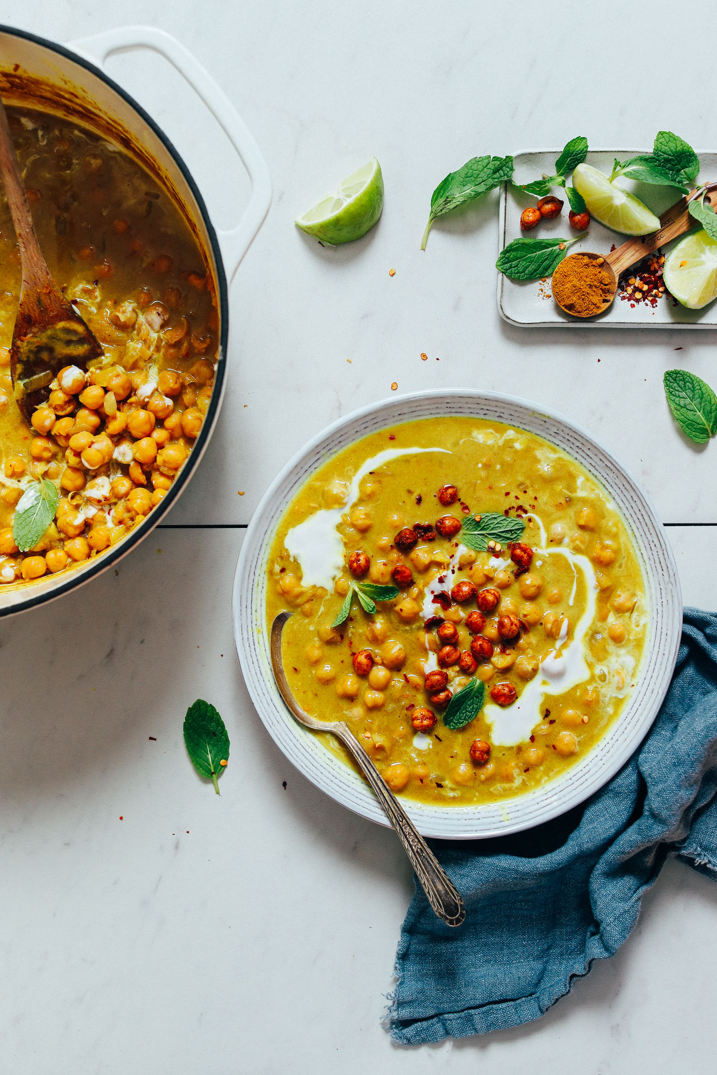 Dutch oven and bowl filled with vegan Curried Chickpea Soup