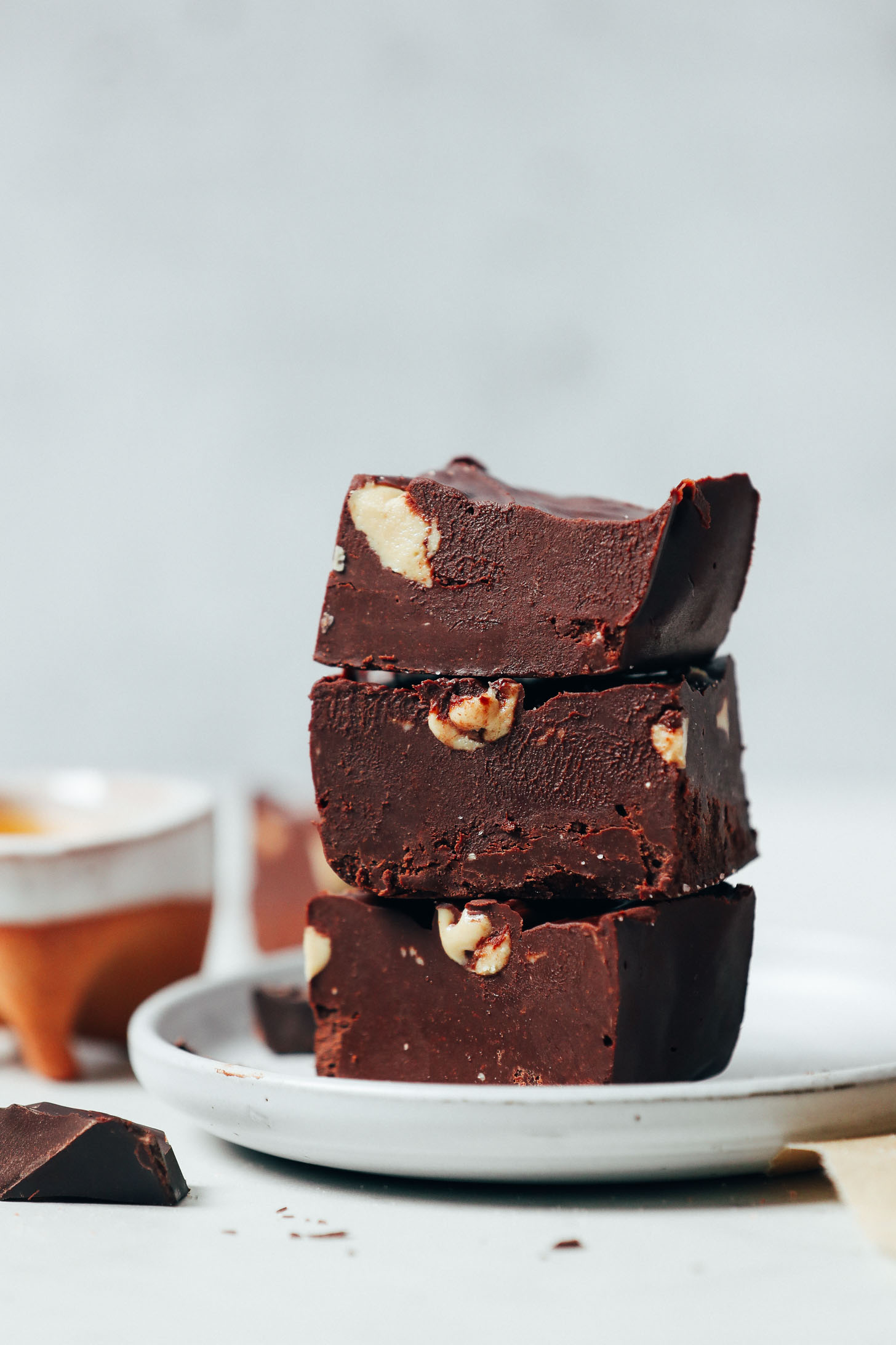 Plate with a stack of three slices of our easy dairy-free Chocolate Fudge recipe