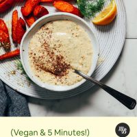 Plate of carrots and sauce with text reading Vegan and 5 Minutes! 4-Ingredient Dill Garlic Sauce