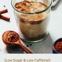 Spoonful and jar of our stress-relieving Adaptogenic Hot Chocolate Mix