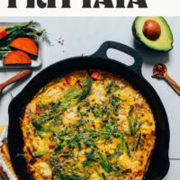 Overhead shot of a cast iron skillet filled with our easy spring frittata recipe