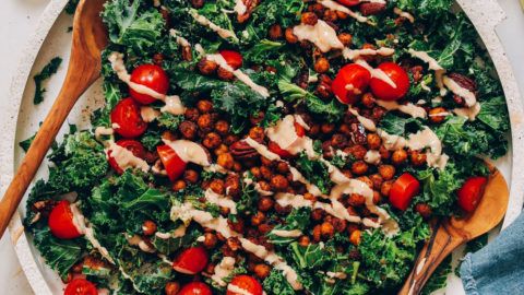 Large platter of our Chickpea Chopped Kale Salad drizzled with Chipotle Dressing