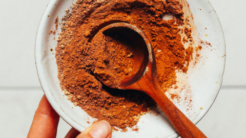 Wooden spoon in a bowl of homemade Pumpkin Pie Spice