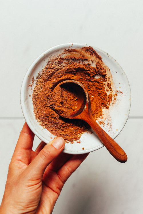 Wooden spoon in a bowl of homemade Pumpkin Pie Spice