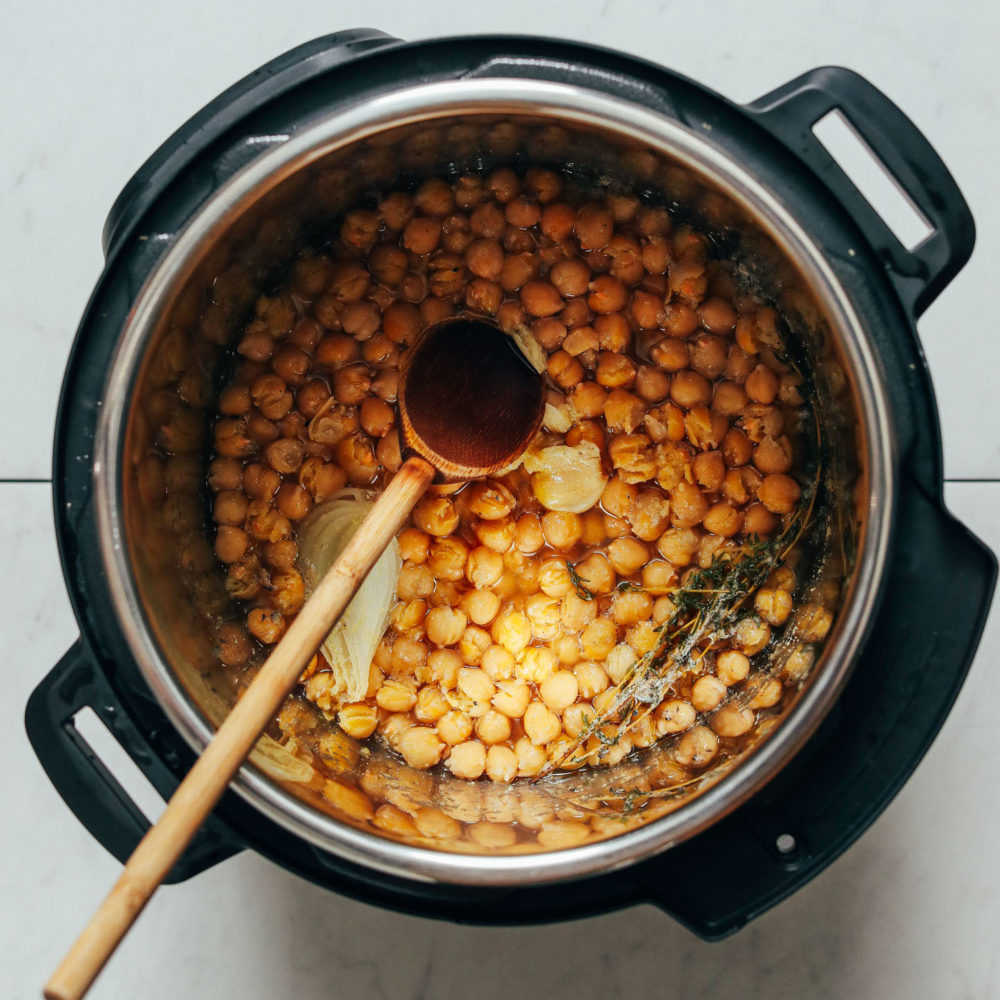 Instant Pot Chickpeas with a wooden spoon