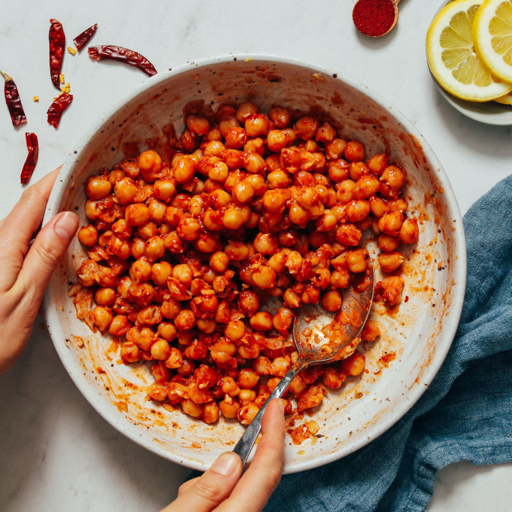 Spoon in a bowl of Harissa Chickpeas