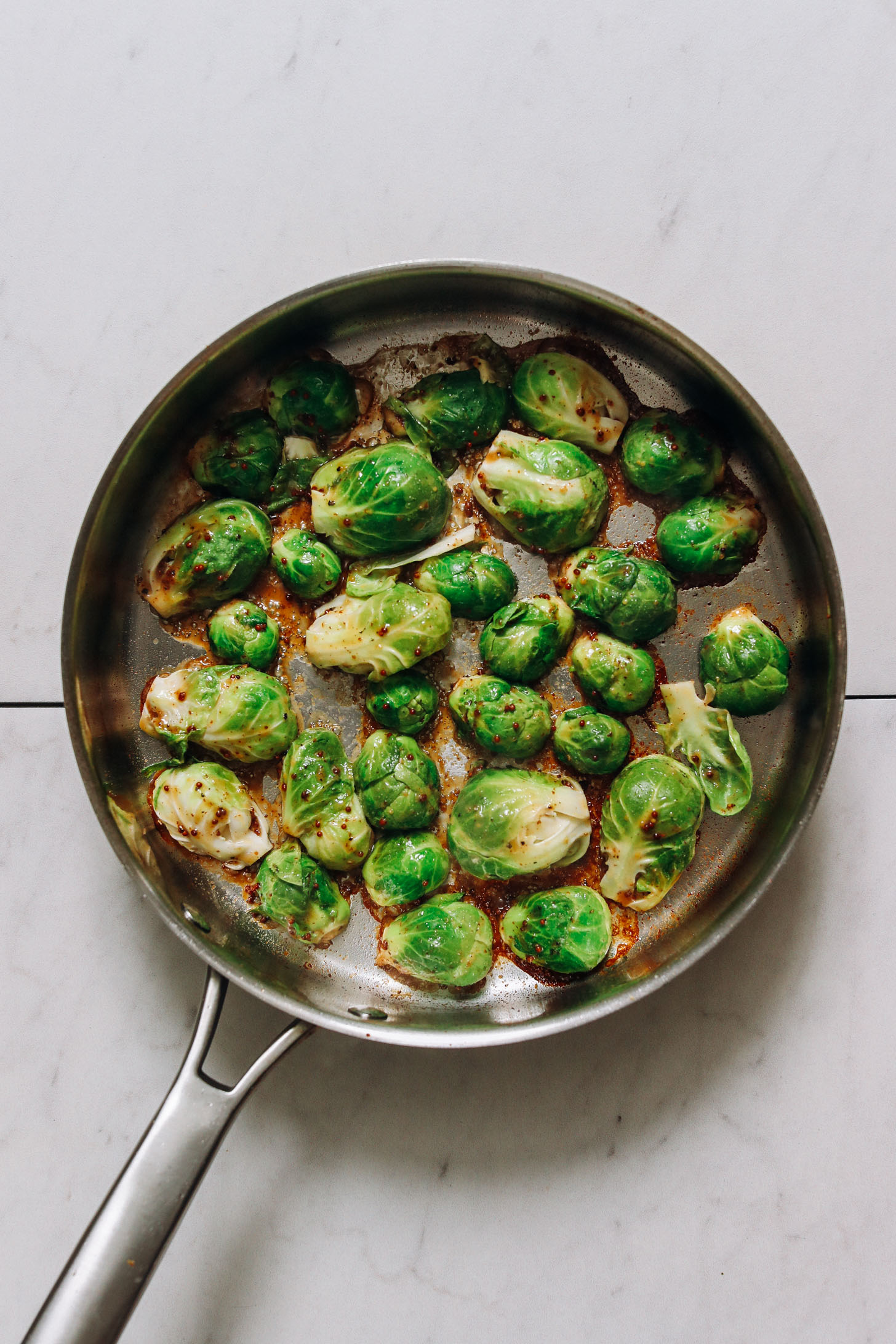 Cooking Brussels sprouts cut side down in a pan