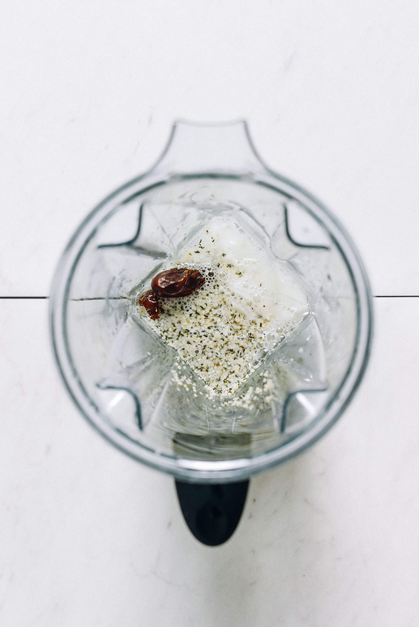 Blender with coconut, hemp seeds, and dates