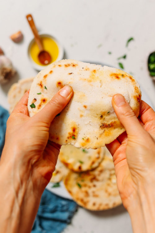 Holding a piece of fluffy gluten-free naan