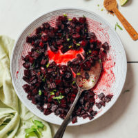 Bowl of Roasted Beet Relish topped with fresh cilantro