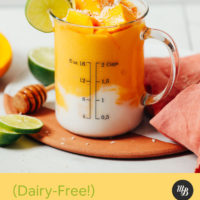 Measuring glass of our Mango Lassi Smoothie made with coconut yogurt