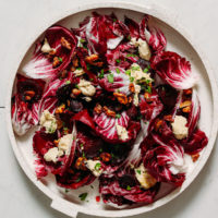 Platter of radicchio salad with candied walnuts, beets, and dressing