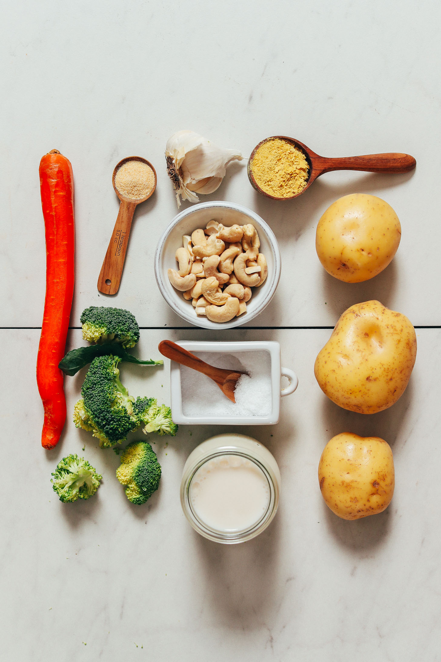 Carrot, broccoli, dairy-free milk, salt, cashews, garlic powder, garlic, nutritional yeast, and gold potatoes