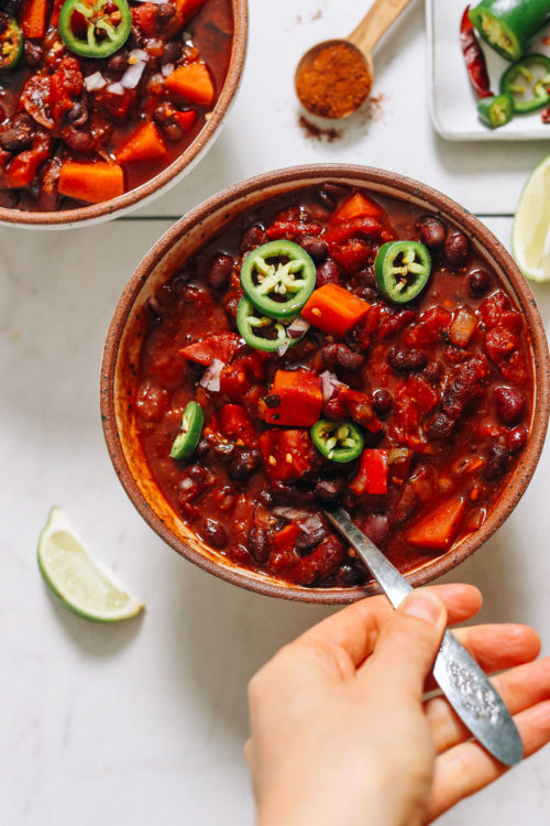 Bowl of Instant Pot chili topped with sliced jalapeño